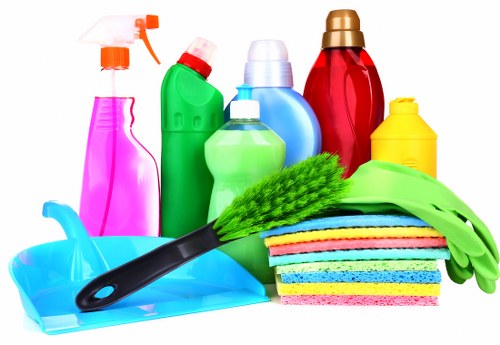 Living room rug cleaning process with a vacuum and soft brush