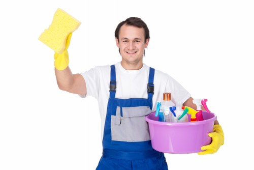Professionals cleaning living room surfaces during end of tenancy cleaning