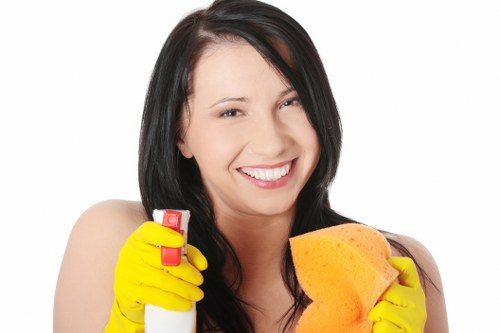 Office cleaning team maintaining desks and shared surfaces